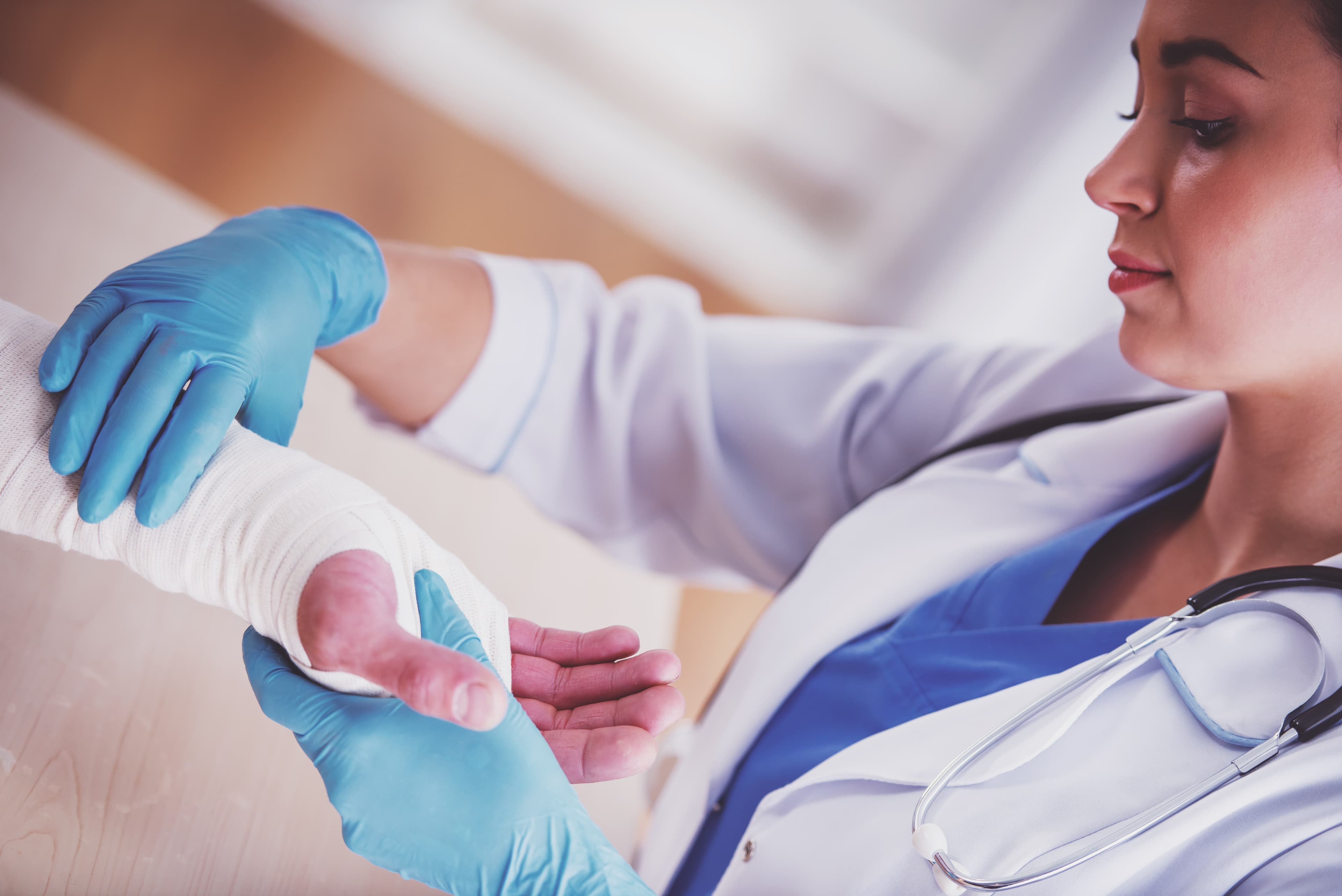 CWCN-AP Eligibility Requirements - Wound Care Nursing Review CWCN-AP eligibility - clinician wrapping a patient arm cast | Wound Care Nursing Review