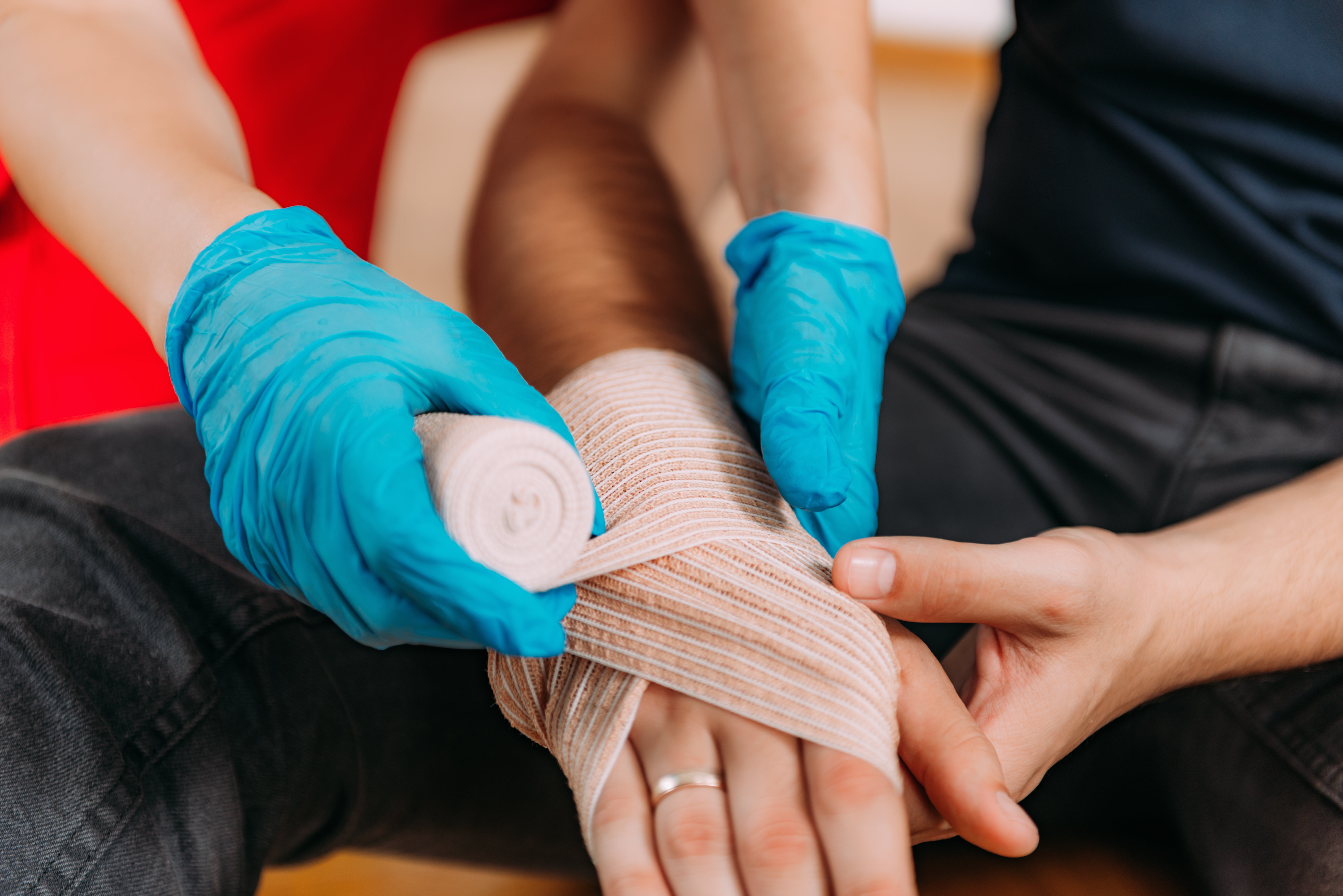 CWCN-AP Question Bank - Wound Care Nursing Review CWCN-AP question bank - gloved hands applying a bandage | Wound Care Nursing Review